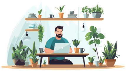 Fototapeta premium A bearded man sitting at a desk in a home office, surrounded by plants. He is wearing a green shirt and black pants, and is working on his laptop. There are two cups of coffee and a book on the desk.