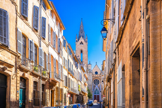 Fototapeta Aix En Provence scenic alley and church view