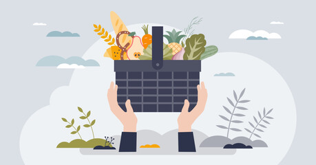 Food drive as grocery donation for poor community tiny person hands concept. Full basket with healthy products for eating vector illustration. Volunteer giving ingredients for soup kitchen campaign.