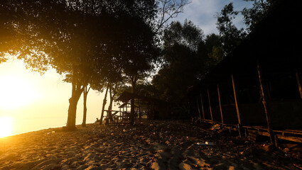 Enjoy the sunrise on the sandy beach which has many simple huts and pioneering restaurants.