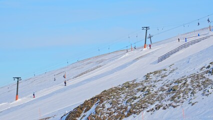 People Going Up Piste Using Gondola Lift Drag Lift Ski Tow at Skiing Slope in Austrian Alps Ski...