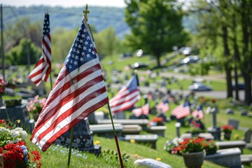 Memorial Day American flags and military grave marker at military cemetery honoring those who sacrificed all in service to their country