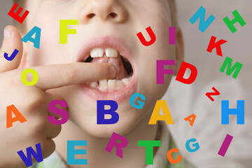 small child 7 years old engaged with speech therapist, gymnastics for tongue front mirror, finger, colored letters, defect, speech disorder with frequent repetition sounds, syllables, spasms muscles