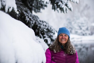 A portrait of a very happy middle aged woman on cold wintery day in Colorado, USA