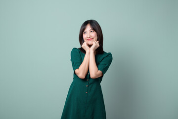 Adorable happy young asian woman model with shy emotion smiling expression cheerful positive...