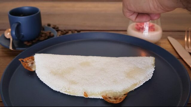 Melted mozzarella cheese tapioca, accompanied by a cup of smoky black coffee. Waiter lighting the candle_2.