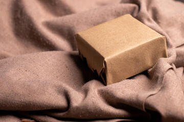  brown color girf box kept on a textile background
