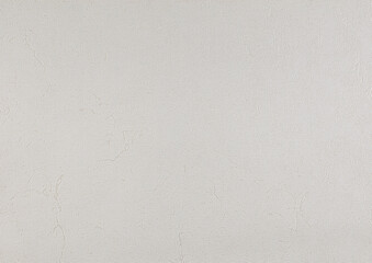 Light gray texture of paper wallpaper or plaster with barely noticeable stripes. The background is light abstract grunge.