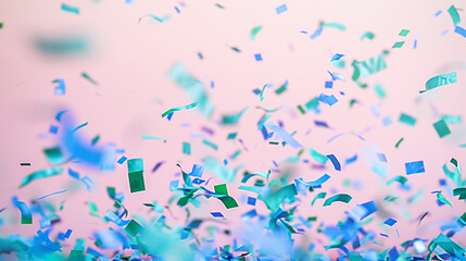 Soft green and royal blue confetti drifting on a pale pink canvas, symbolizing gentle celebration.