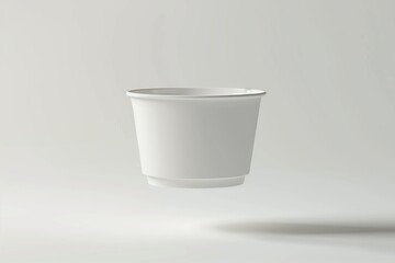 Minimalist White Ceramic Cup on Light Background
