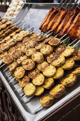 Grilled potatoes on a skewer 