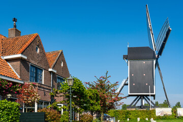 Townscape of Brielle, South Holland. View of the historical windmill named Het Vliegend Hert