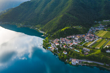 Aerial View of Lago di Ledro in Trentino, Italy, Tranquil Lakeside Village Surrounded by Lush...