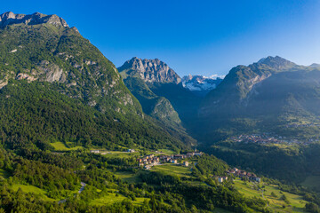 Fototapeta na wymiar Aerial View of Stenico in Trento, Italy, Lush Alpine Village Landscape in Trentino-Alto Adige