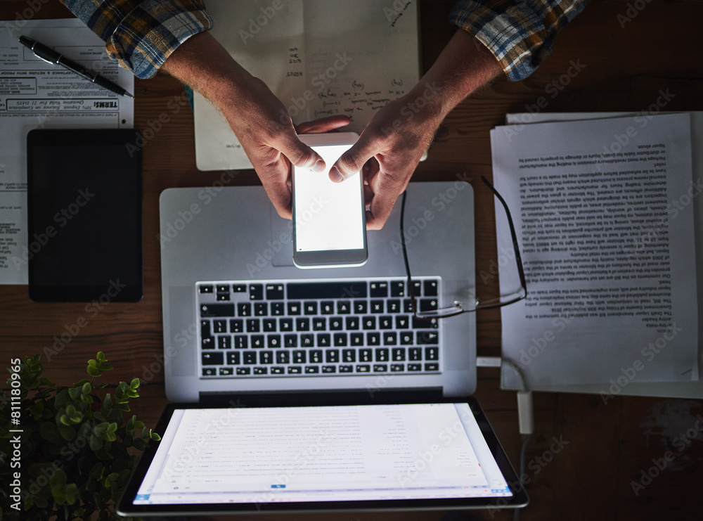 Leinwandbilder Businessman, programmer and typing on phone screen in office with laptop for data analytics, coding and software script. Top view, tech expert and employee hands with mockup, it developer and notes