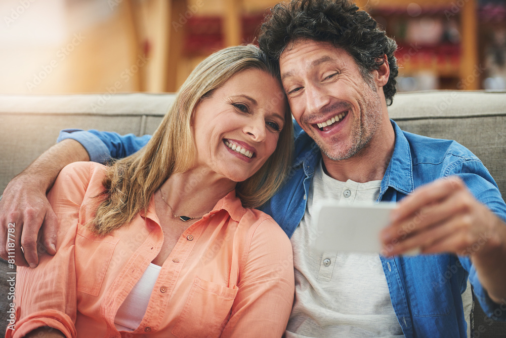 Poster couple, selfie and sofa in home, smile and excited for memory with bonding for love with connection.