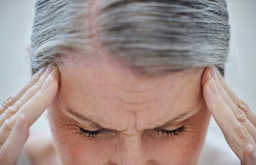 Fototapeta premium Headache, closeup and mature woman with fatigue and burnout from stress in office and business. Frustrated, person and migraine with brain fog in workplace and health crisis from anxiety or worry