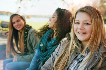 Portrait, smile and teen group with autumn, forest and nature for college break and bonding....