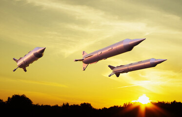 Missiles fly to the target. Missiles against the sunset. Missile defense. 3d-rendering