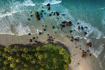 Stunning beach aerial landscape scenery, Beautiful beach waves surrounded with coconut trees