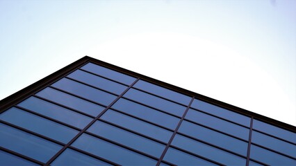 abstract background of building with glass facade against the sky