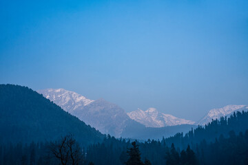 Beautiful mountain landscape scenery from Kashmir, Snow covered mountain with pine trees on the background
