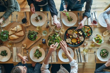 A group of entrepreneurs having a productive conversation while sitting at a table with plates of food, A group of entrepreneurs having a productive conversation over a working lunch