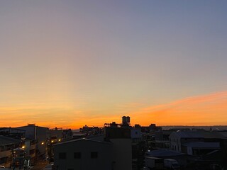 Naklejka premium sunset over the city