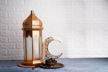 Iftar background, Ramadan Mubarak concept photo Moroccan lantern lamp with dates and crescent moon on the background