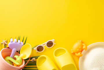 An array of summer beach toys including a bucket, shovel, and sunglasses laid out on a yellow background, capturing the essence of a sunny beach day