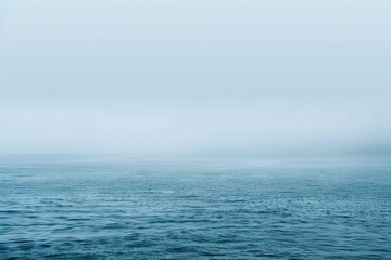 Obraz premium Tranquil Blue Sea Landscape with Foggy Background. Perfect Image for Nature Lovers and Ocean