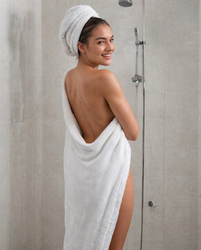"Young sexy  Woman Wrapped in Towel in Shower Room"
"Portrait of Smiling Woman in White Towel After Shower"
"Woman Standing in Tiled Shower Room Wearing Towel"