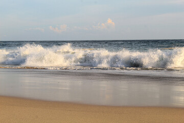 Beautiful view of sea waves on the beach, sunset shot