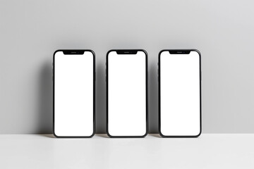 Three smartphones in a vertical arrangement