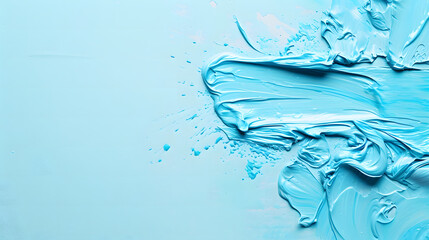 Obraz premium Vivid paint spills cascade onto a light blue backdrop, leaving ample space for text.