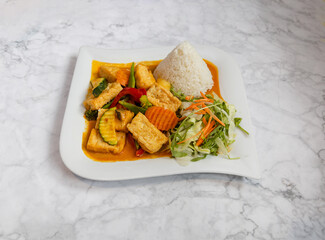 
Thai curry sauce with tofu rice and vegetables, Asian food