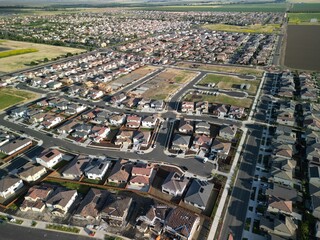 aerial view of a middle class brand new residential houses neighborhood in a city suburbs. suburbia,