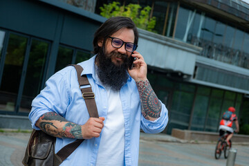 a man talks on the phone on the background of a business center