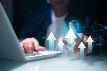 Business men are using technology to analyze data and invest in the capital market. and stock...