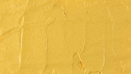Yellow mustard sauce, spread background and texture, top view	