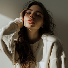 lady wearing sweatshirt, in the style of light beige and beige, rustic simplicity