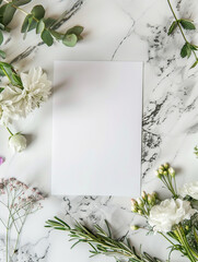 aerial photograph Flatlay style with blank art paper, atop clean marble white table top and fresh flowers
