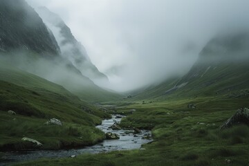 A stream winds its way through a green valley with misty mountains in the background, A misty mountain range shrouded in fog with a gentle stream running through the valley