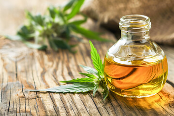 Hemp seed oil on a wooden background