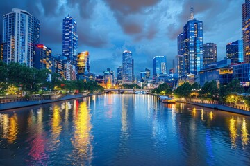 Obraz premium River Flowing Through City at Night, A panoramic view of a bustling city skyline at dusk, with twinkling lights reflecting on the river below