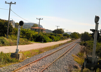 Railway Tracks and Power Lines through Countryside in Greece