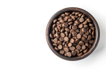 Fototapeta premium A bowl of dog food with many small pieces of food in it with copy space