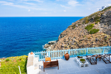 Typical white house with sunny terrace against blue sea in Kastro village, Sifnos island, Greece