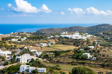 View of farming lands with white houses and hills in background near Apollonia village, Sifnos...