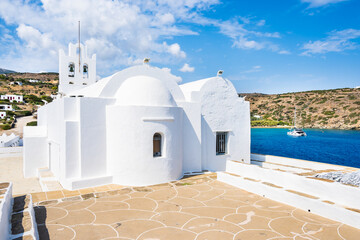 Chrysopigi monastery and beautiful white church with sea in background, Sifnos island, Greece